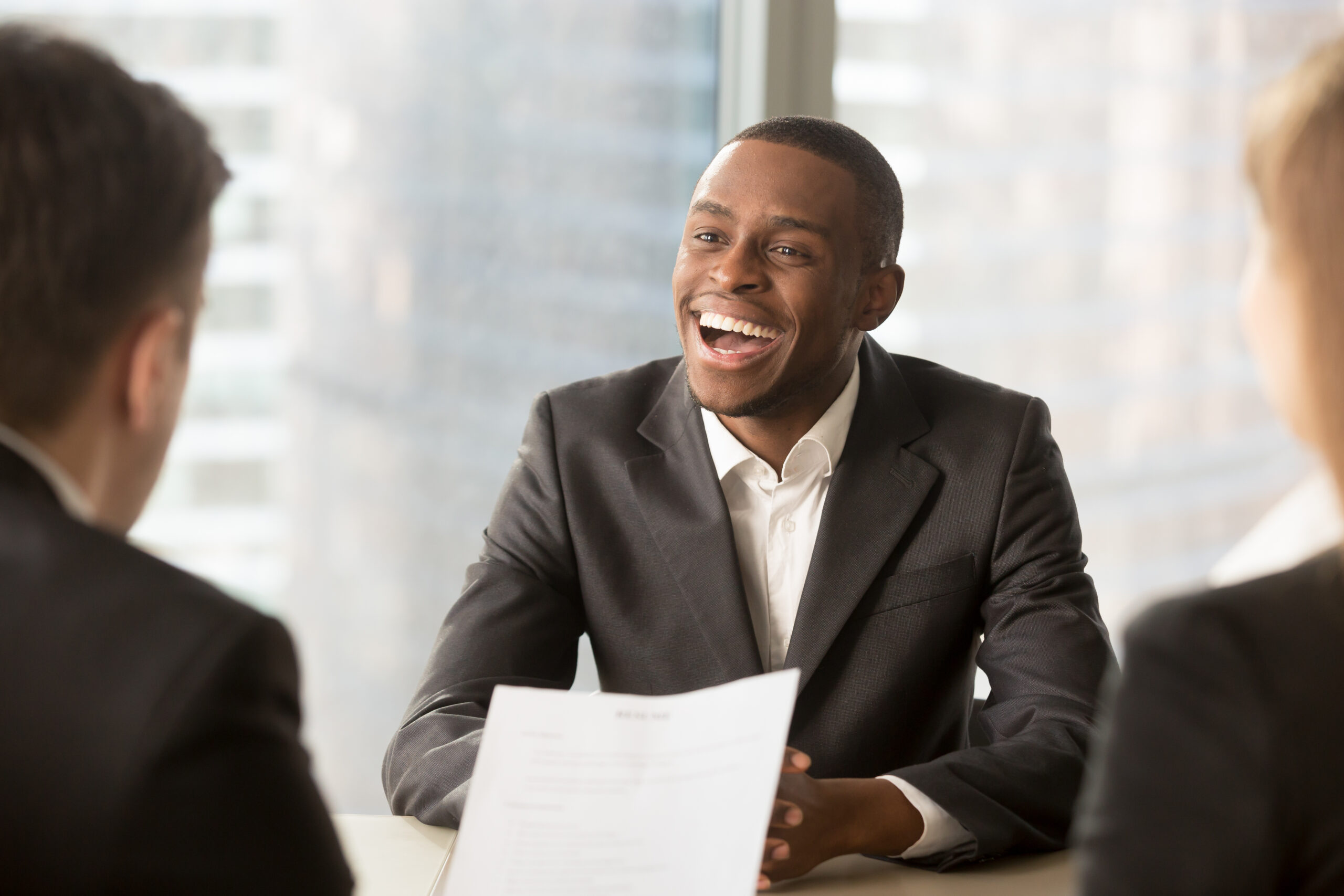 Successful happy black male candidate getting hired, got a job Happy black successful candidate getting hired, cheerful african applicant with beaming smile got a dream job in big company, dark-skinned businessman excited by great news, startupper found investor